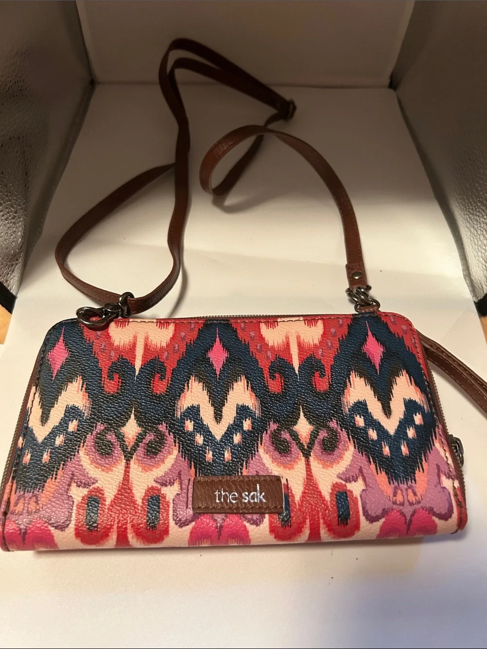 The sak iris crossbody wallet boho ikat print festive black pink cream casual
